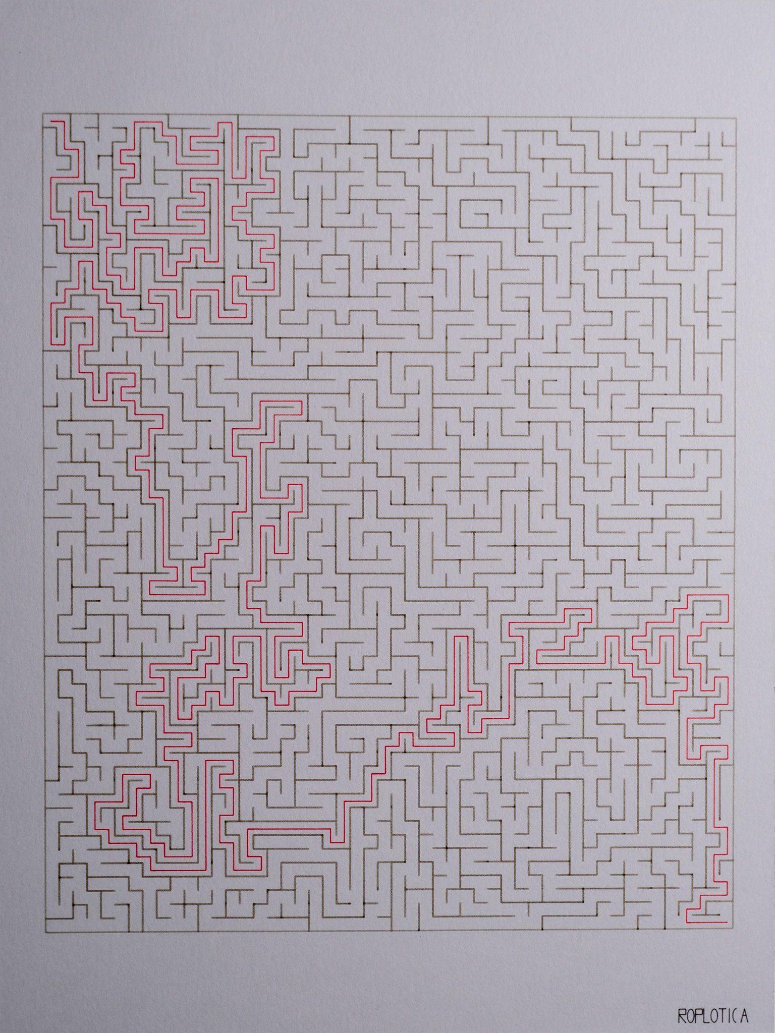 Maze — dense algorithmic labyrinth with red solution path on deckle-edge paper